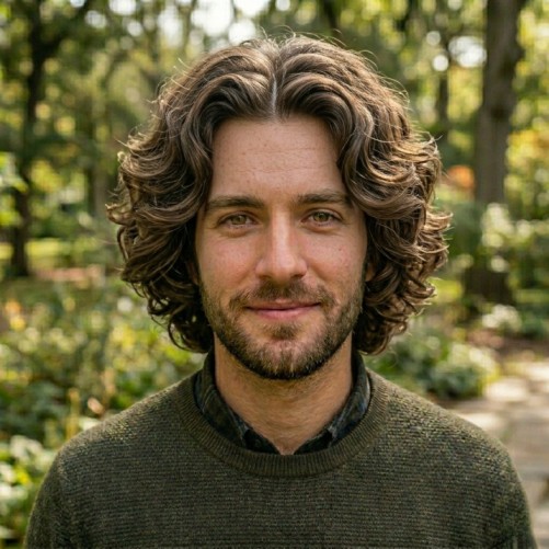 Curtain medium hairstyle for men with middle part and face framing layers